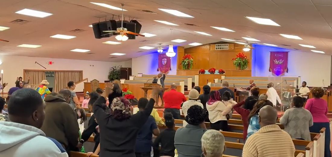 Members of Lakeview Community Temple standing in worship during a service